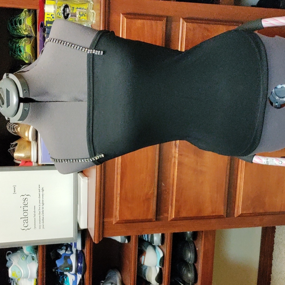 Black tank top with rhinestone straps. Rayon poly blend with straight neckline